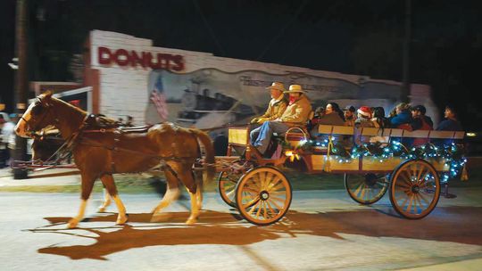 Horse-drawn wagon rides were a new addition to this year’s Collinsville Christmas On the Square event.